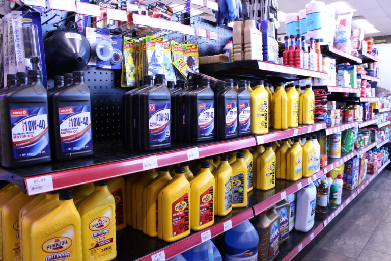 A retail gondola featuring auto oil and other auto care products.