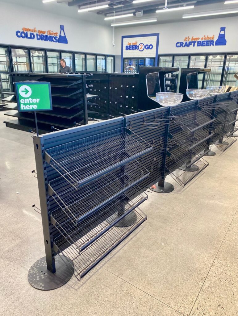 An empty q line retail display unit in a store